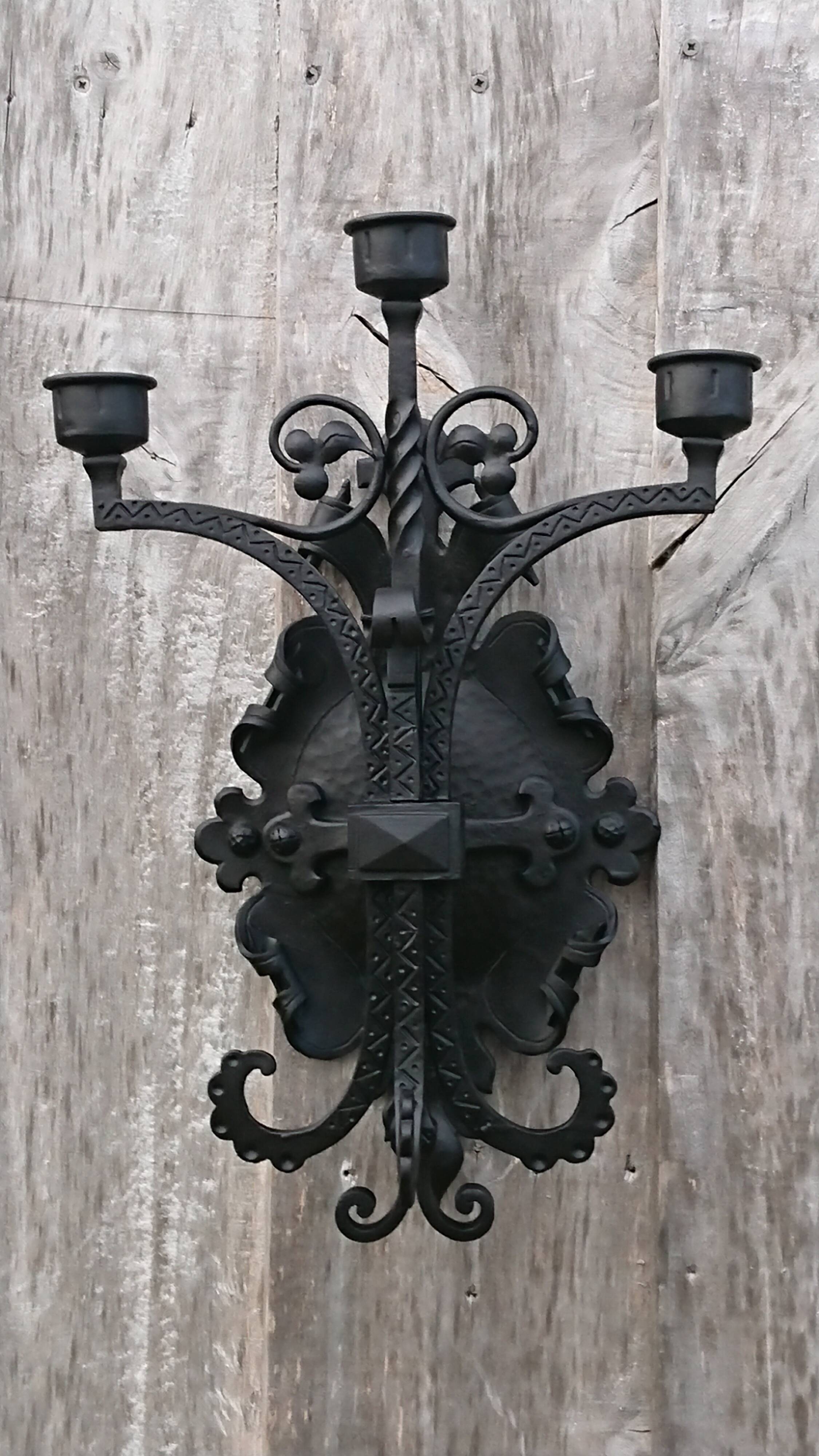 Pair of black wrought iron sconces - neo-Gothic style - from the 1950s