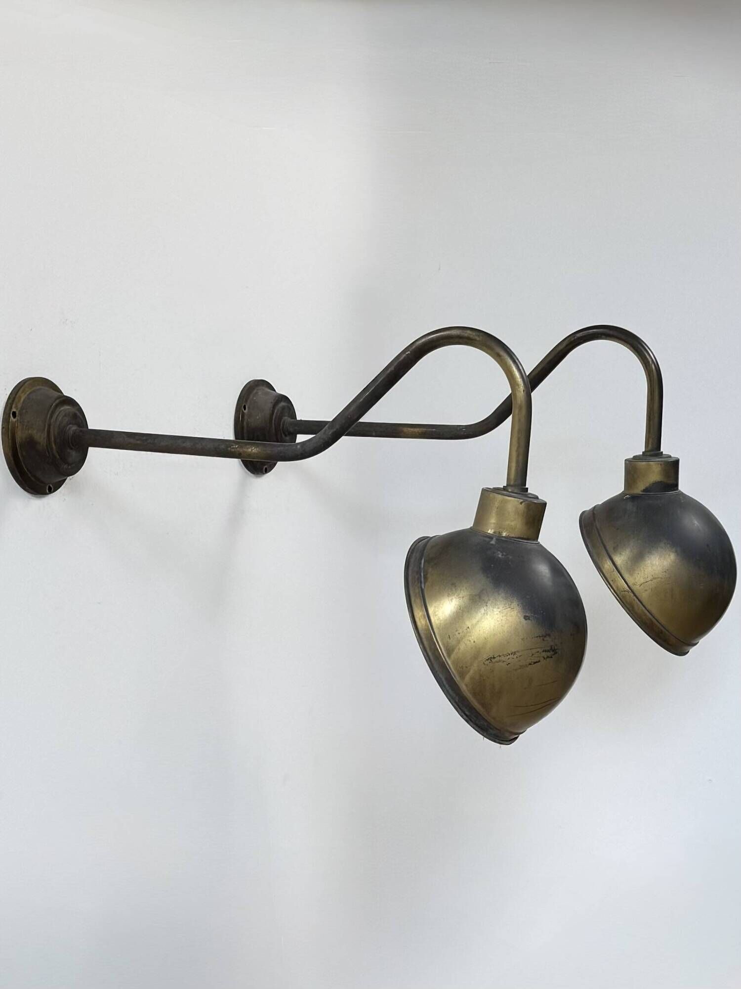 Pair of XL patinated brass wall lights, France, 1970.