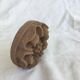 Pink sandstone paperweight in the shape of a rosette