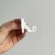 Bathroom décor, hooks, soap dish, white metal hangers.