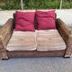 Exotic 2-seater sofa in woven banana tree / rattan and brown fabric.