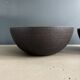Pair of black lacquered metal catchall bowls