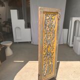 Rectangular Indonesian construction element with blue and yellow plant in carved wood