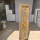 Rectangular Indonesian construction element with blue and yellow plant in carved wood