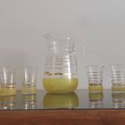 Old pitcher with its 8 yellow granite glasses with gold edging vintage 50's