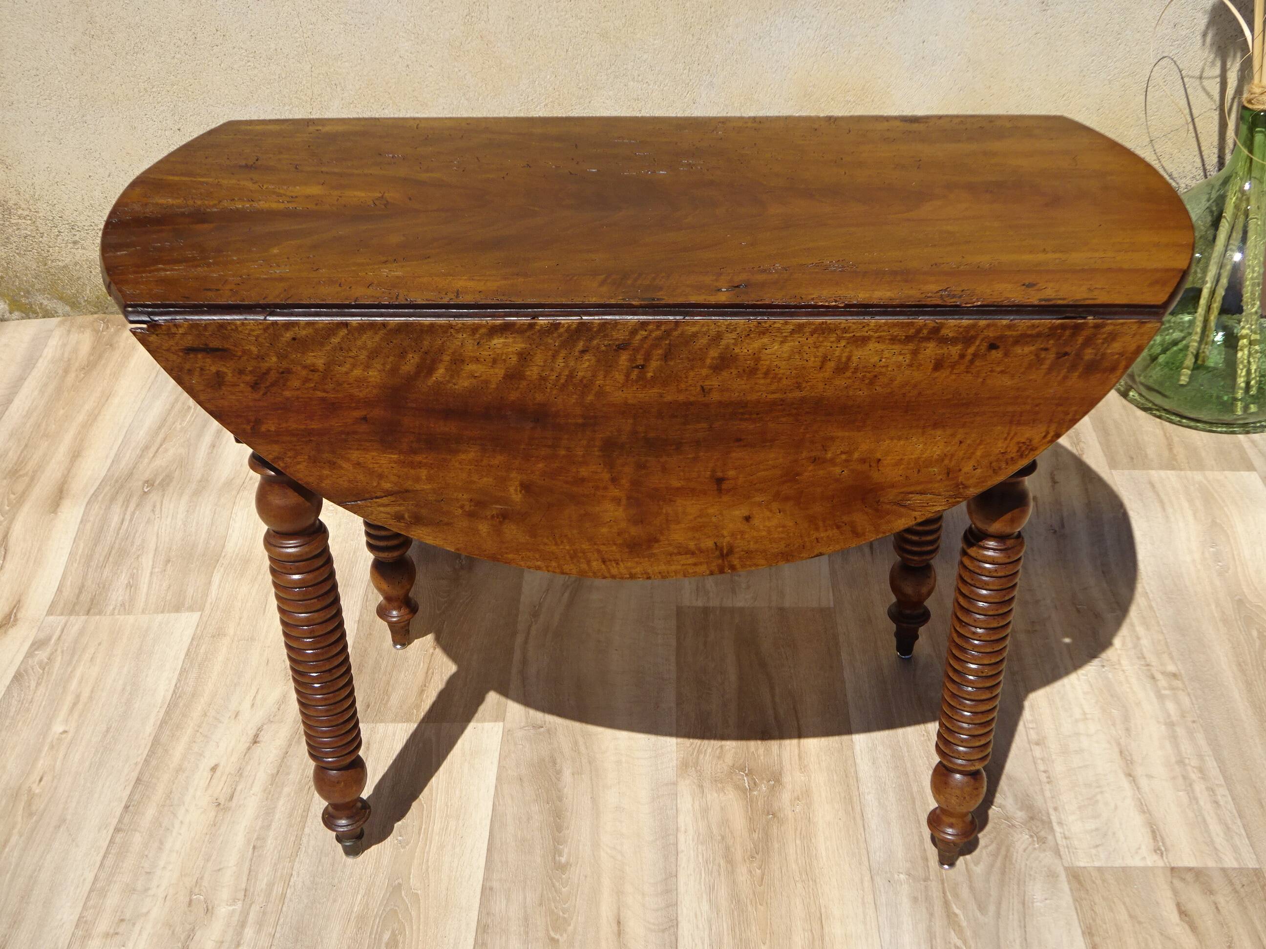 Antique walnut console table with honey spoon legs.
