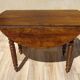 Antique walnut console table with honey spoon legs.