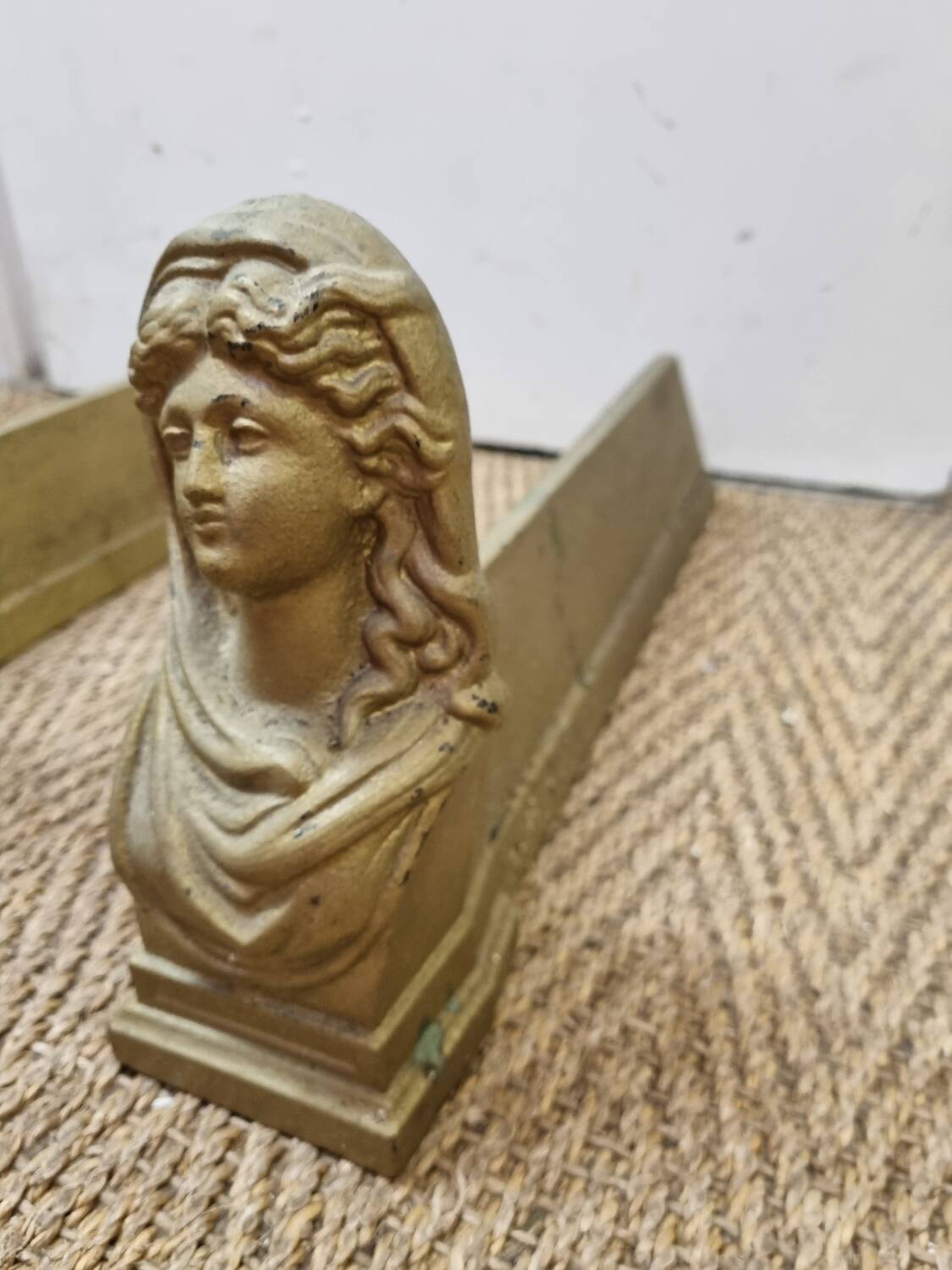 Cast iron andirons heads of women