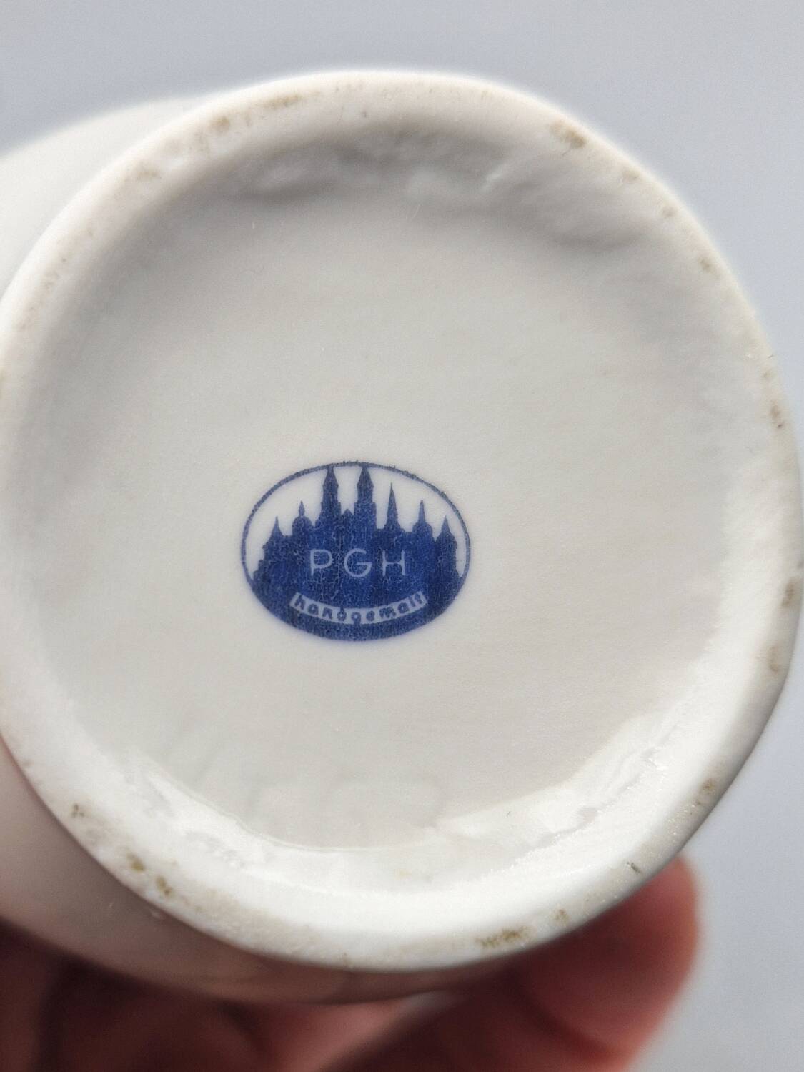 Hand painted German porcelain pitcher with floral design and gold trim