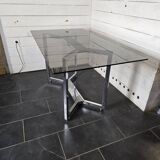 Chromed metal table with smoked glass top