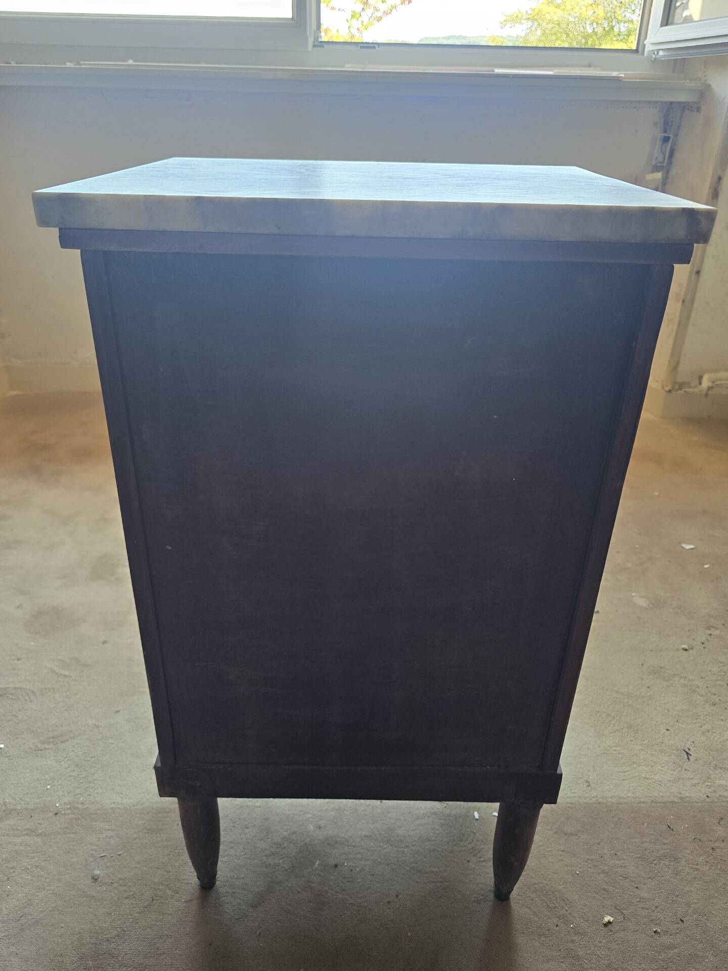 Antique Empire-style bedside table with marble top.