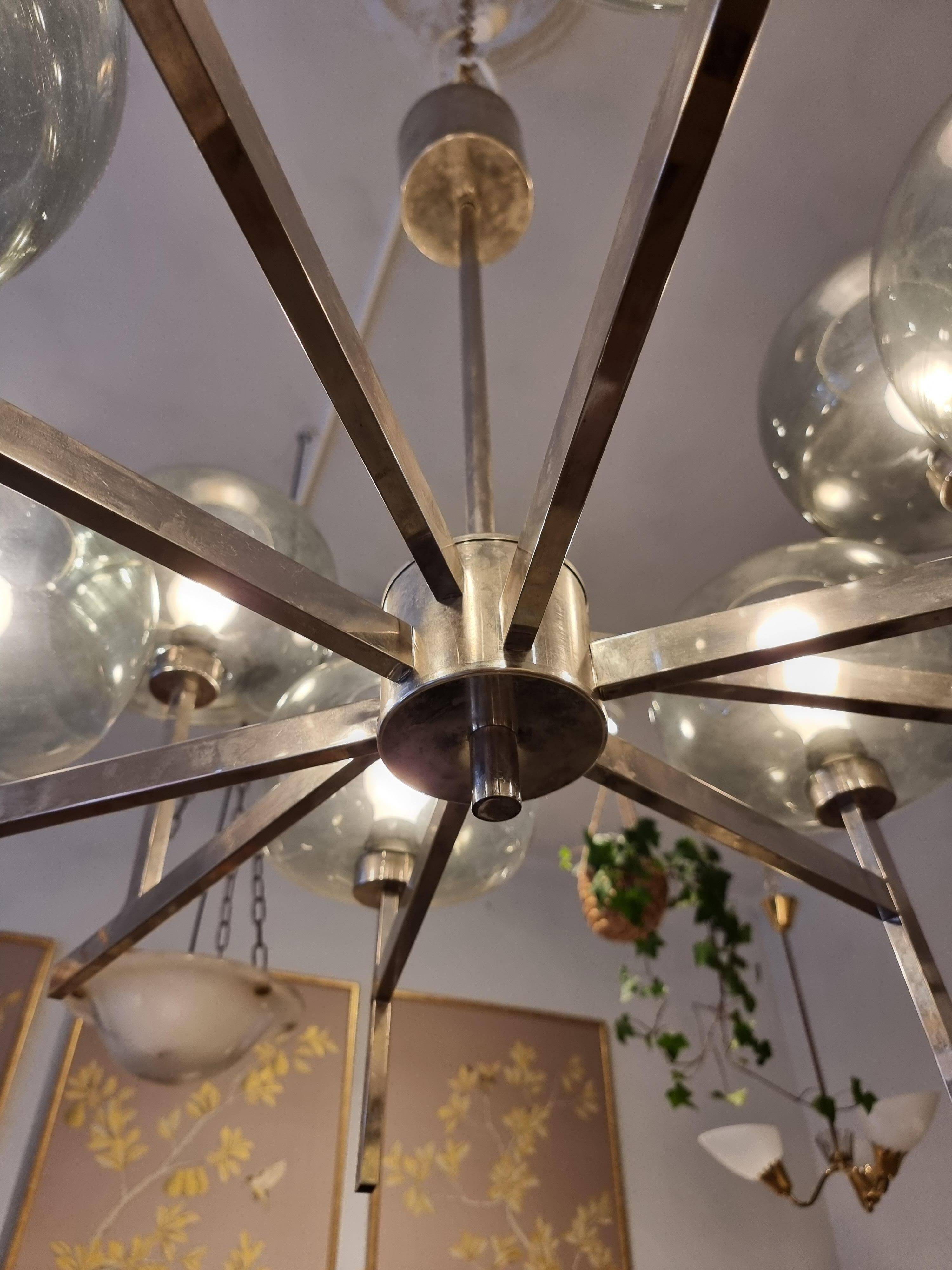 Timeless modern Scandinavian / mid-century chandelier in chrome and smoked glass.
