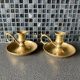 Two brass hand candle holders