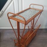 vintage rattan magazine rack with glass top, missing a rim of the magazine rack