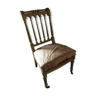 Chaise basse dorée