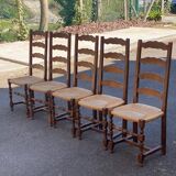 4 or 5 solid wood chairs with light oak straw and high backs