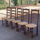 4 or 5 solid wood chairs with light oak straw and high backs