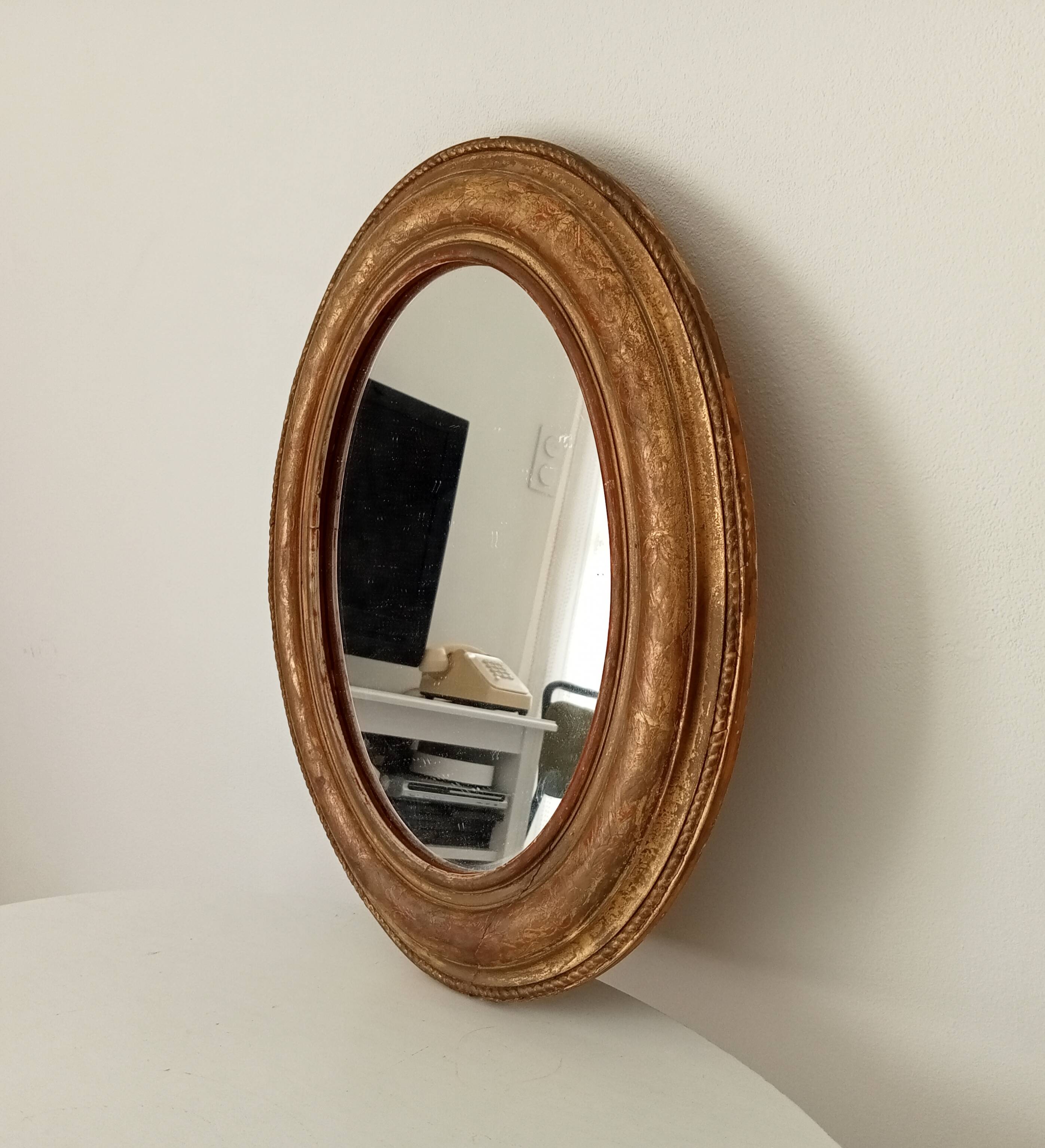 Louis Philippe 19th century oval gilded mirror in wood and stucco