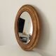 Louis Philippe 19th century oval gilded mirror in wood and stucco