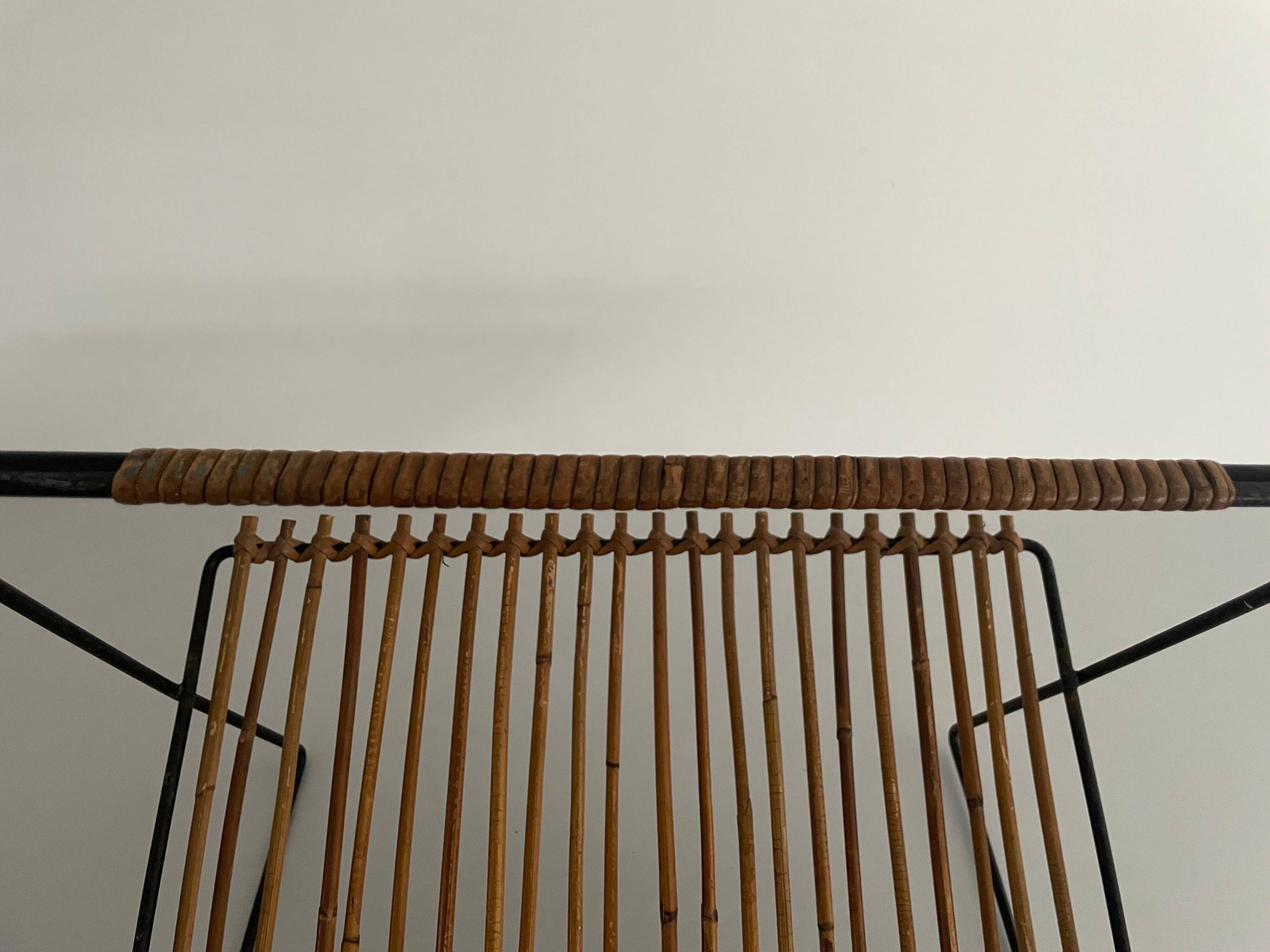 Mid-century black metal and rattan magazine rack, 1960, Italy