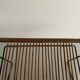 Mid-century black metal and rattan magazine rack, 1960, Italy