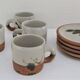 Four pottery cups and saucers from La Colombe Vallauris