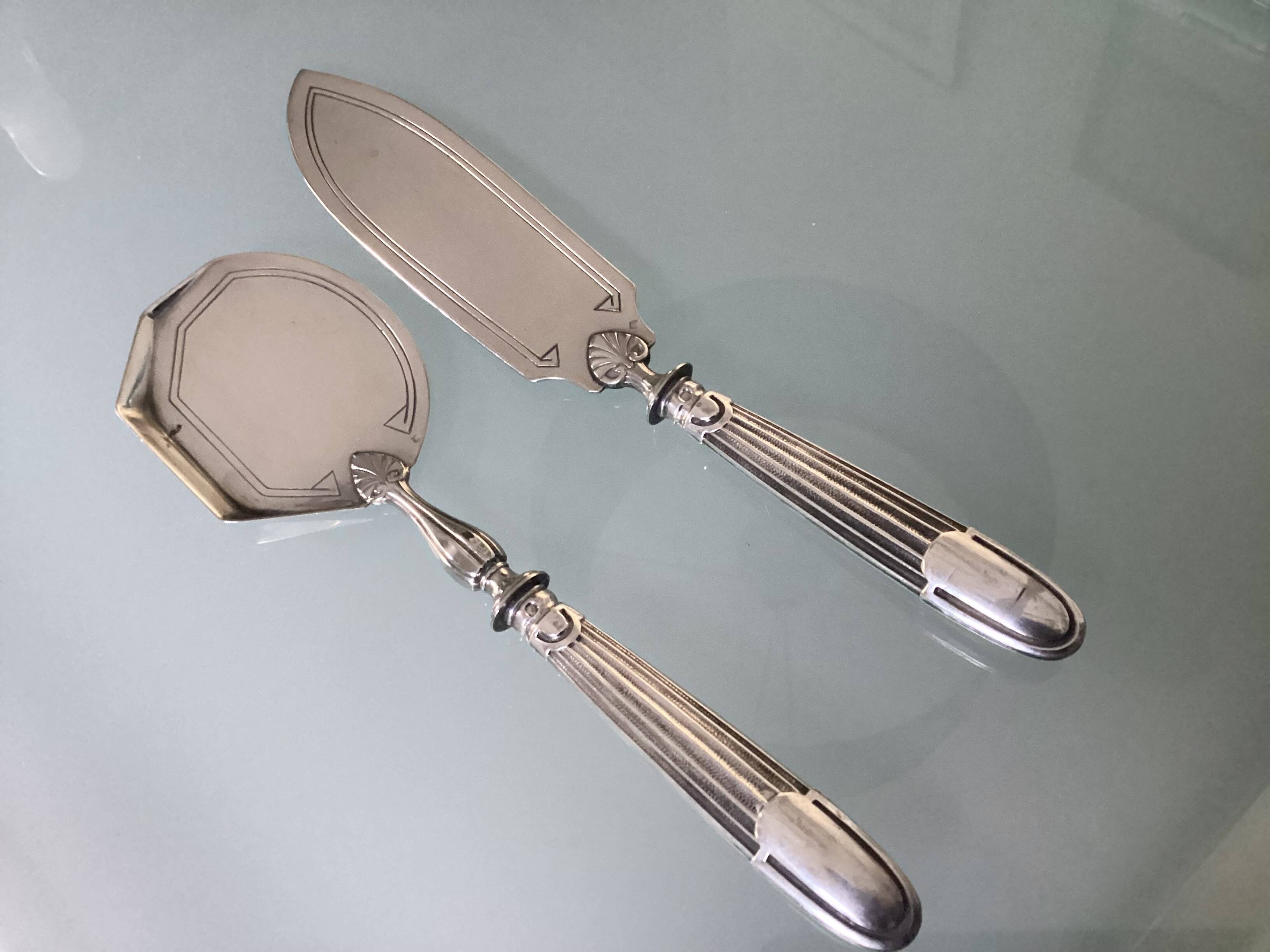 Antique silver serving cutlery with a Minerva hallmark.