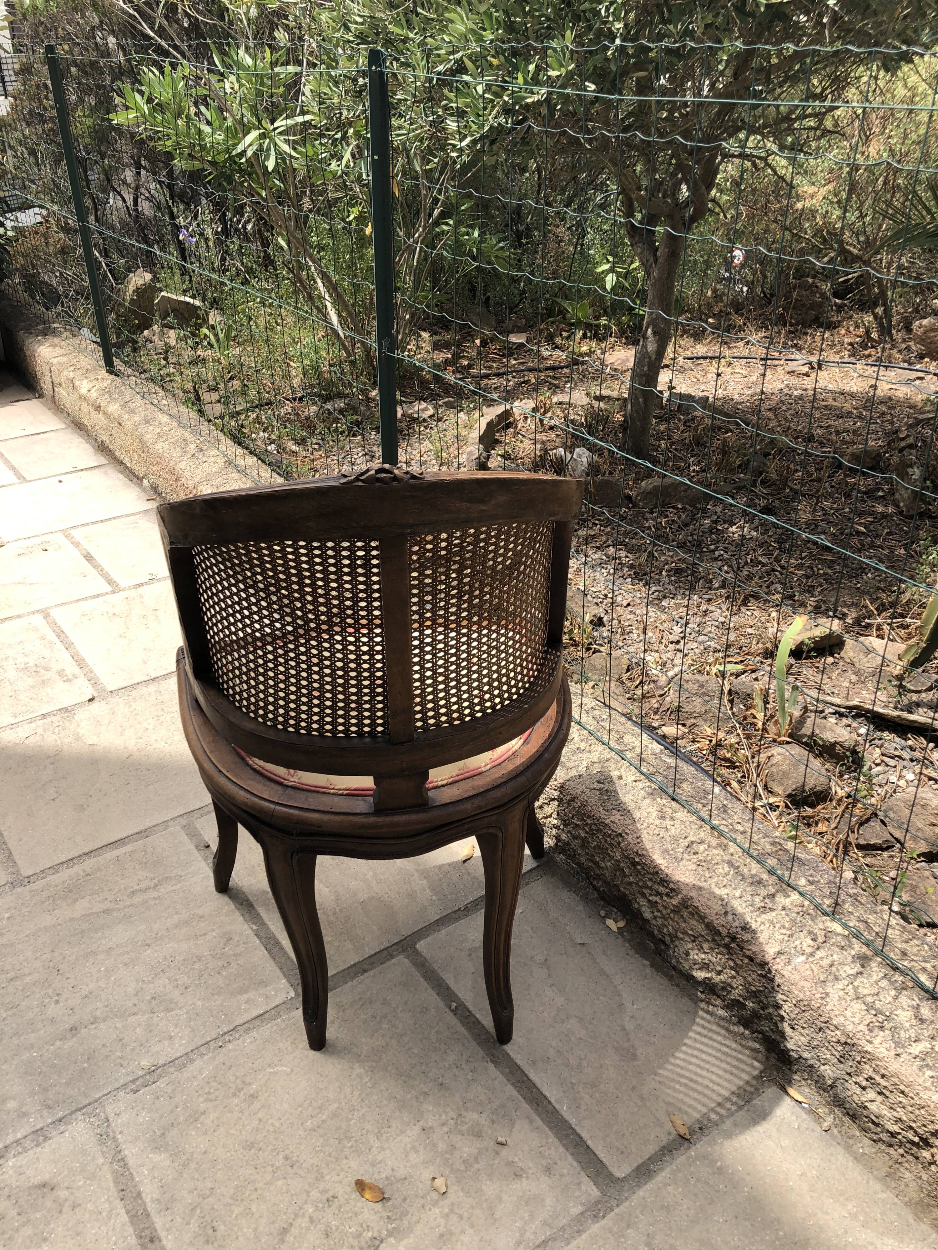 Old wooden armchair and cannage