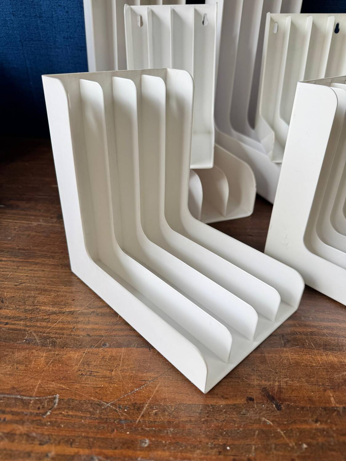 Set of 6 boomerang-shaped vinyl record racks/storage units. 1970s/80s.