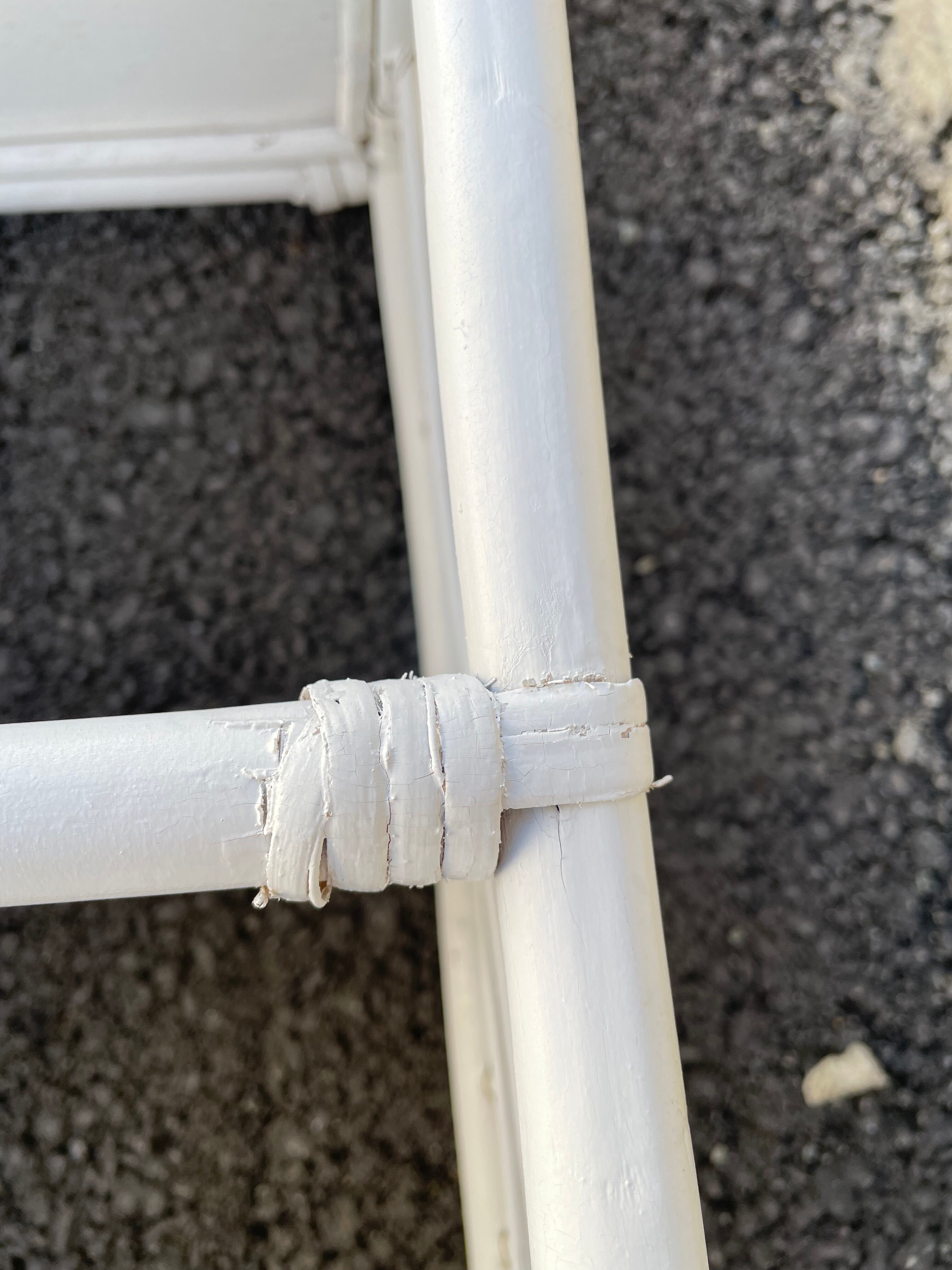 White rattan shelf with braces