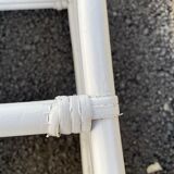 White rattan shelf with braces