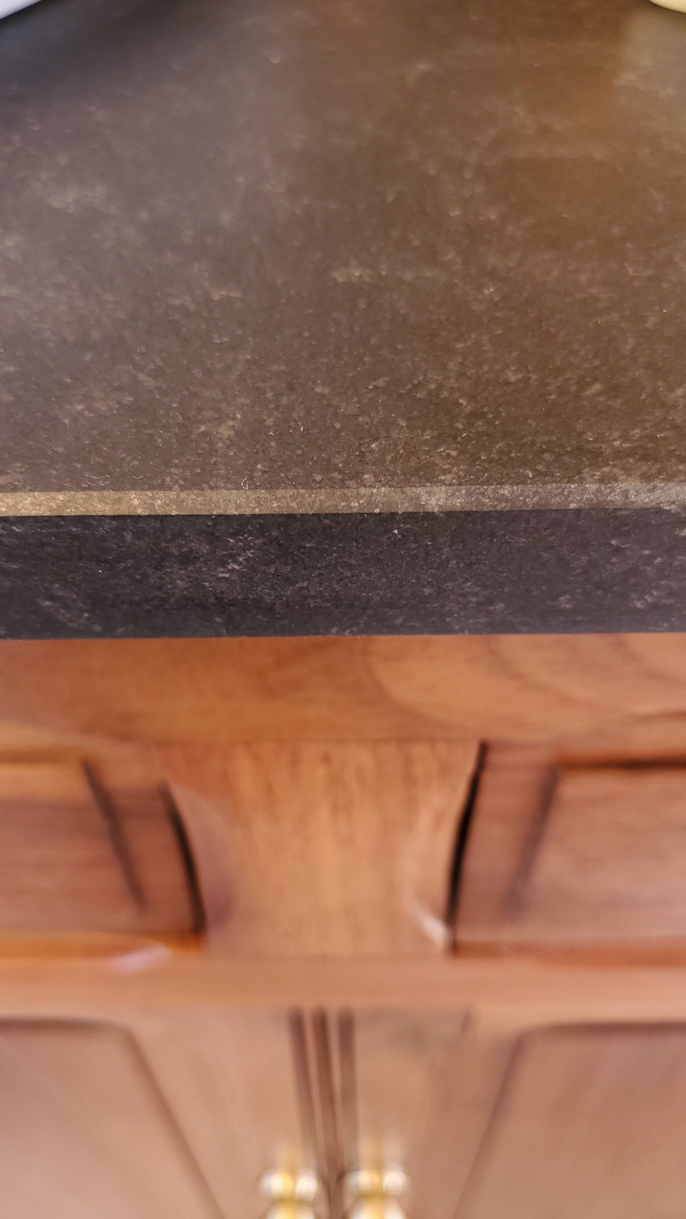 Vanity unit in solid walnut and Zimbabwean granite.