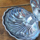 Shell-shaped butter dish in stainless steel and blue glass