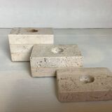 Trio of travertine candlesticks
