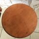 Round end table with tripod mast. 50 years. Medium oak color.