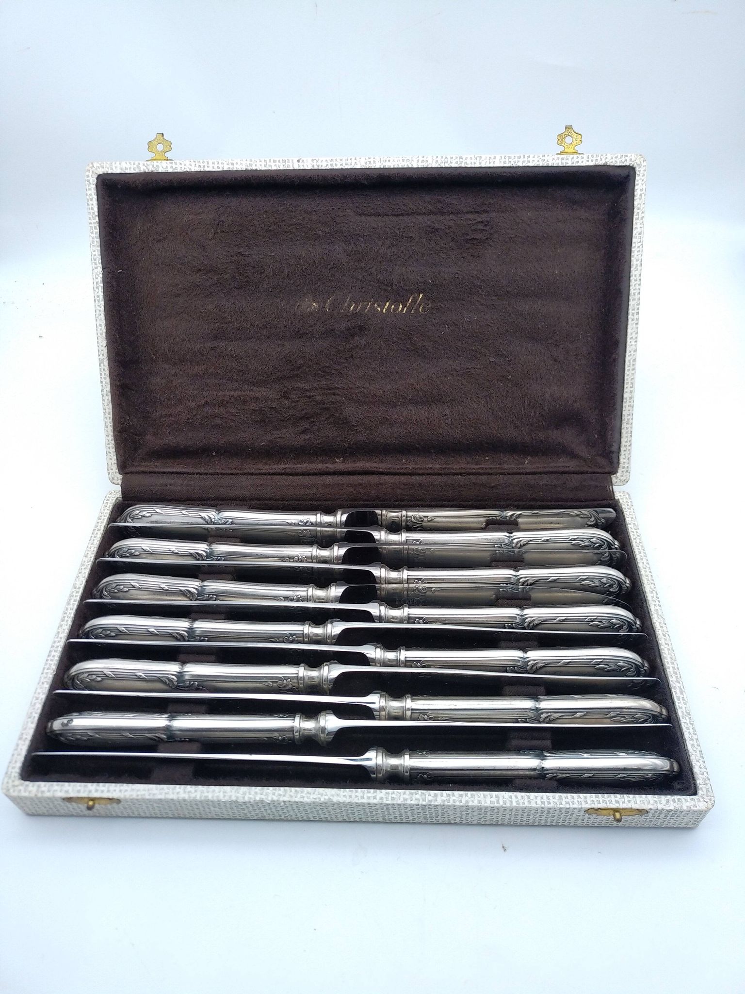Set of 12 sfam knives in silver metal and stainless steel blades.