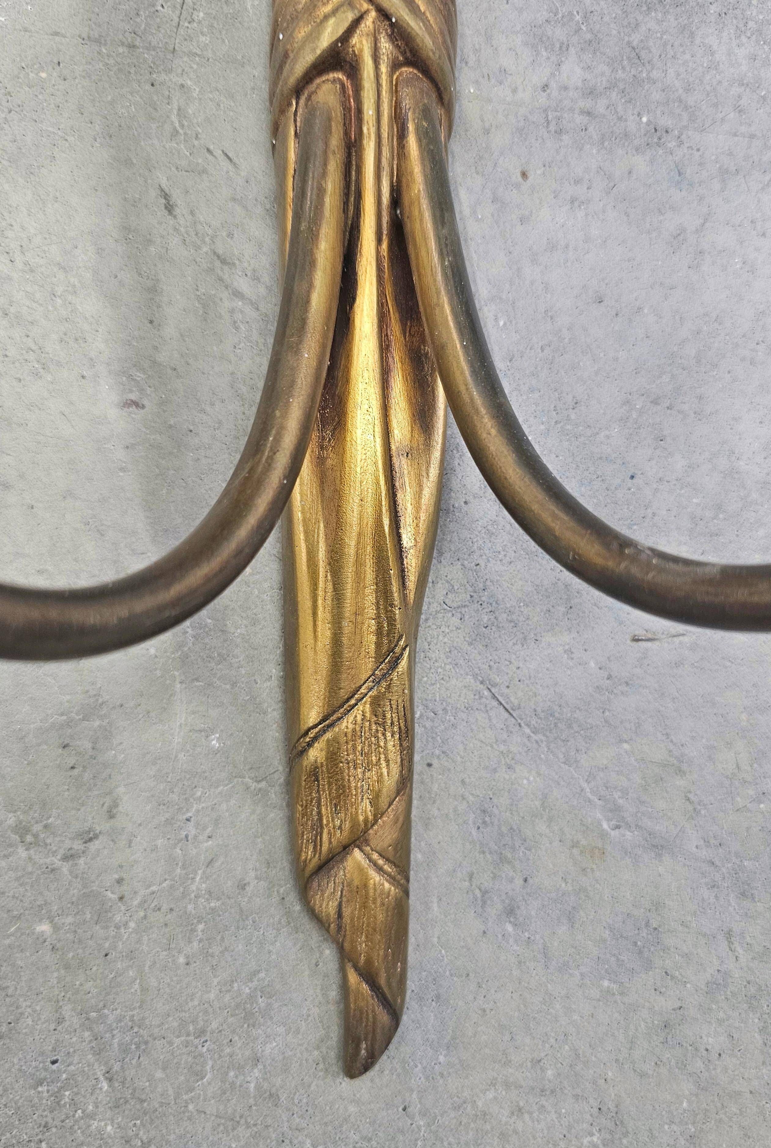 Pair of Louis XVI style bronze wall sconces with bow and tassel, 1940s.