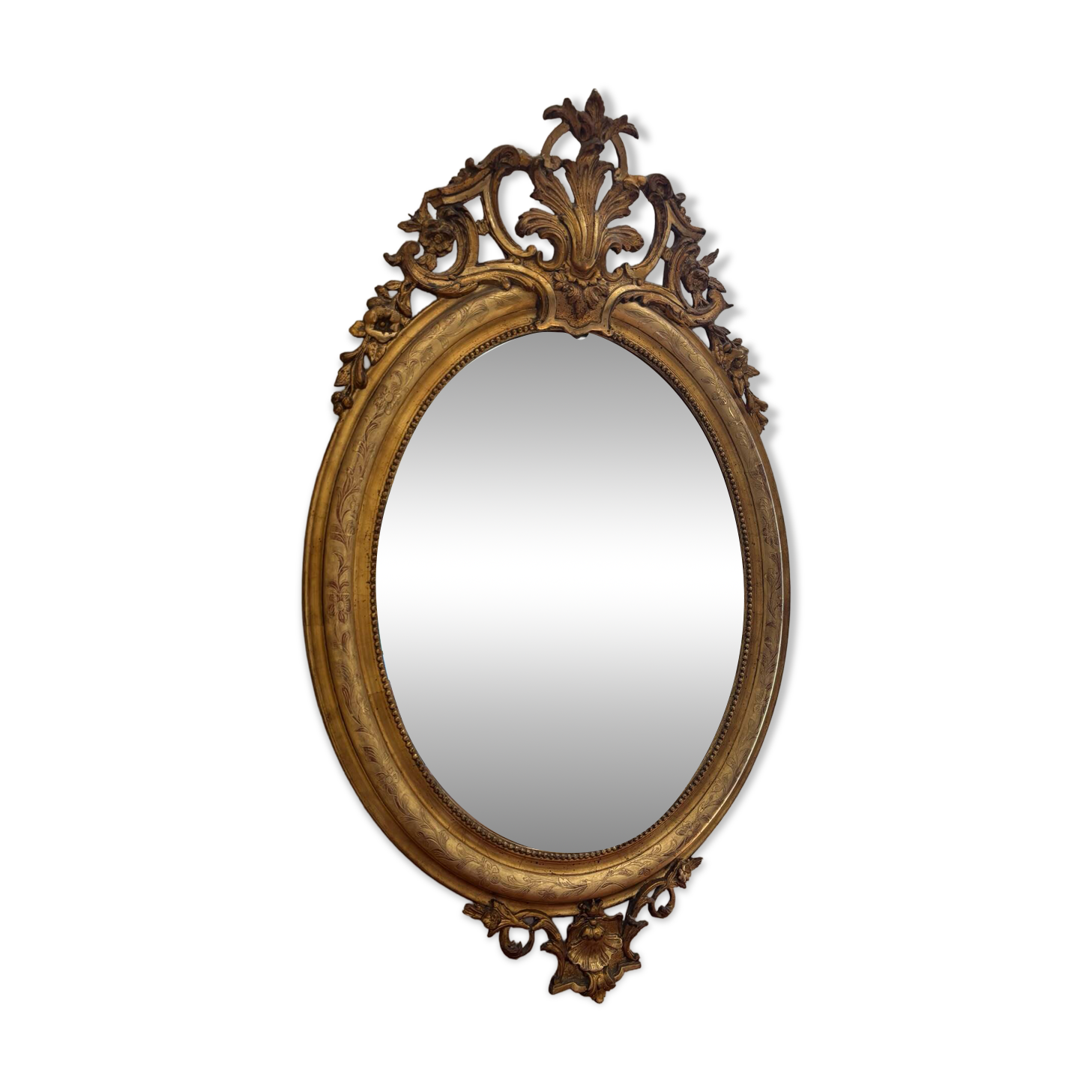 Golden oval mirror