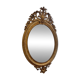 Golden oval mirror