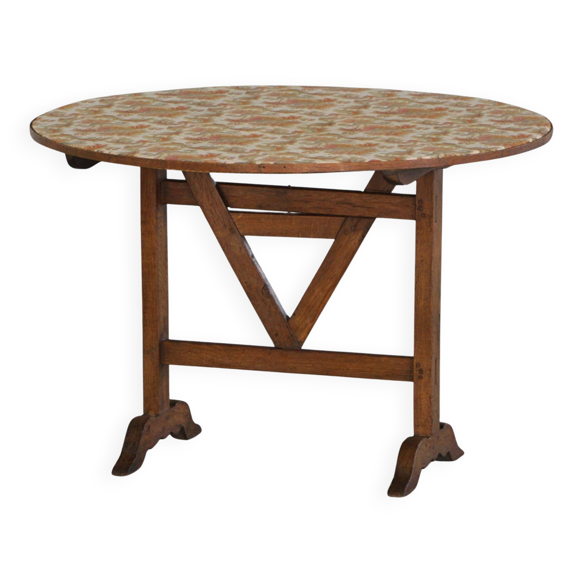 19th-century French round wine table with an adjustable top and floral textile surface.