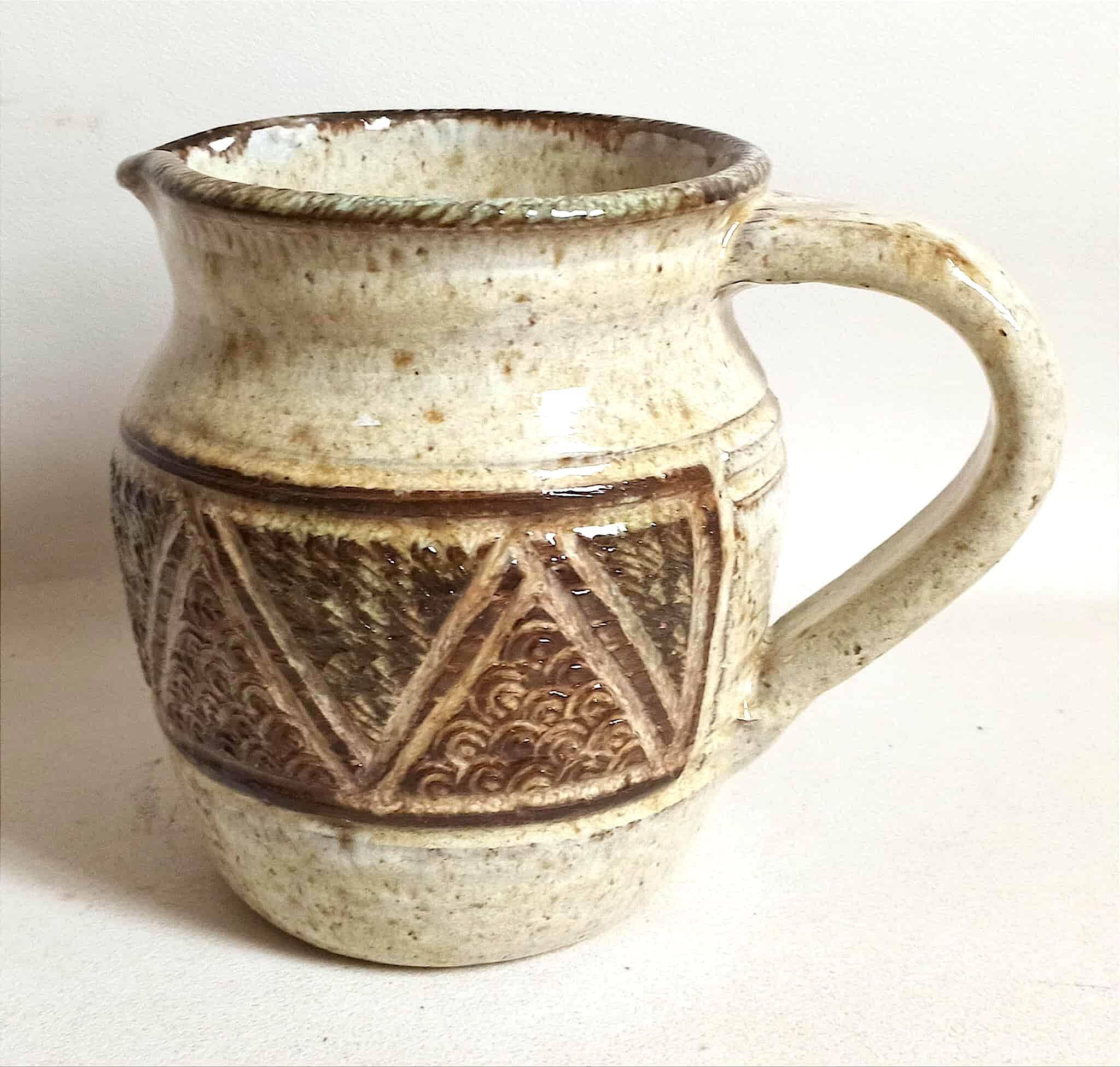 Stoneware pitcher stamped Giraud. Height 18.5 cm