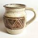 Stoneware pitcher stamped Giraud. Height 18.5 cm