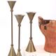 Trio of brass candlesticks by Christian de Beaumont