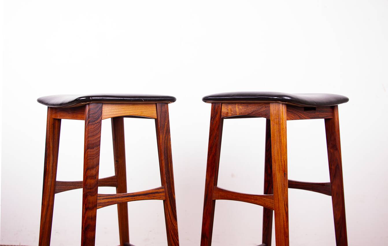 4 Danish high stools, rosewood and black leather, Knud Bent for Dyrlund.