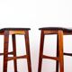 4 Danish high stools, rosewood and black leather, Knud Bent for Dyrlund.