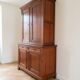Antique solid wood sideboard with doors and drawers.