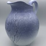 Blue glazed terracotta pitcher with hand-painted decoration, signed