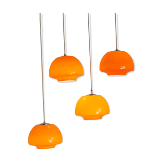 Set of four seventies opalic orange glass pendants