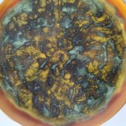 Set of 4 flamed enamel plates in green and amber from the 60s-70s.