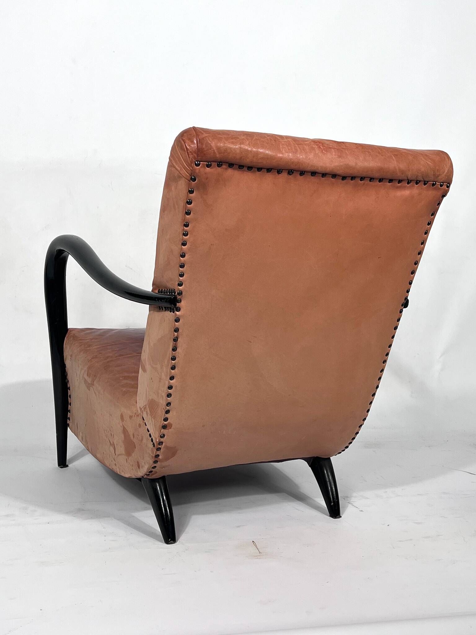 Sculptural Italian Mid-century leather and curved wood armchair from 50s